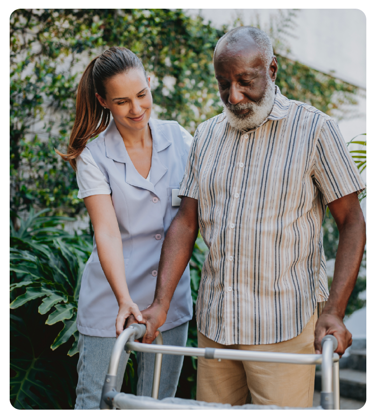 Clinician supporting an older adult during a walking assessment